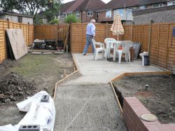 Lion John tests if the concrete is dry